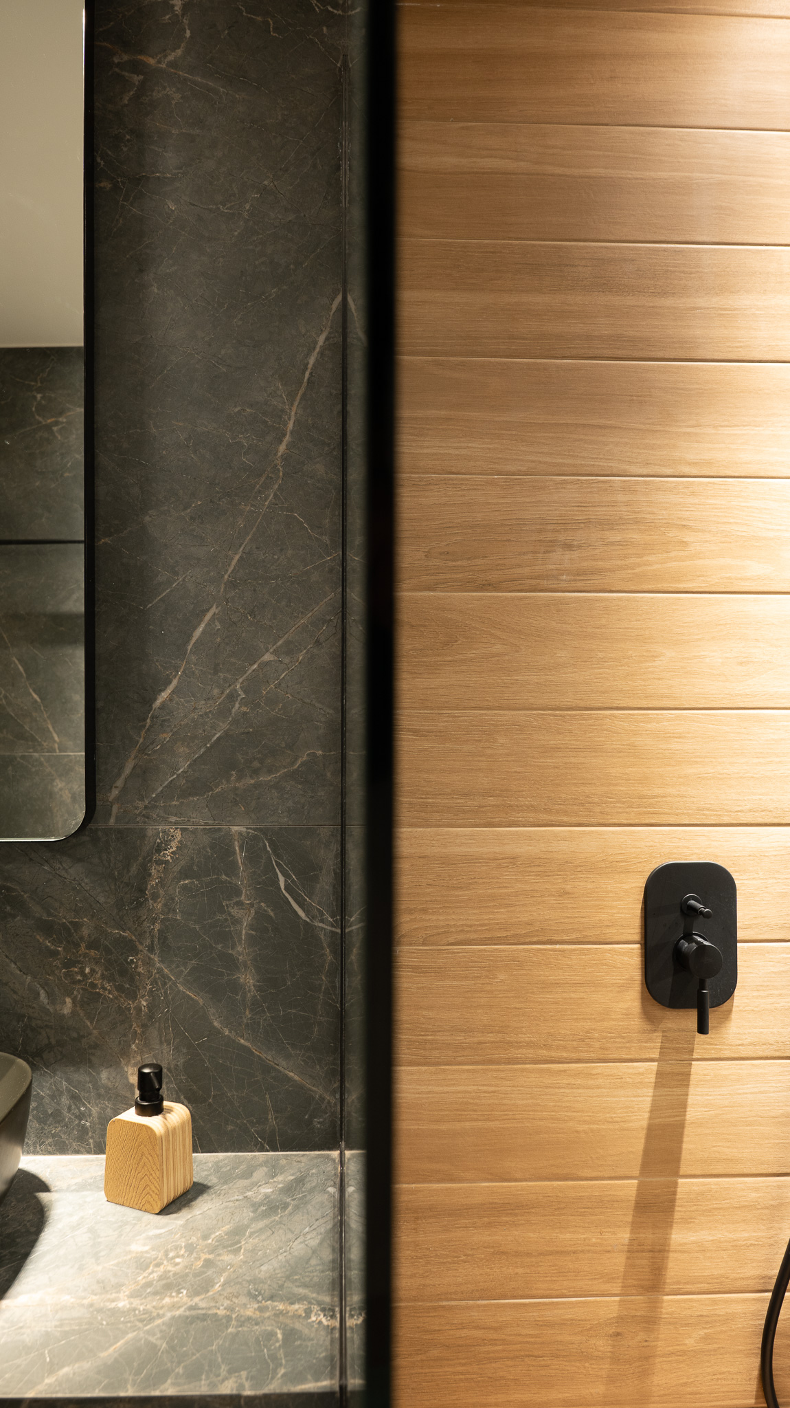 A&K Chorothetisis, material join of grey marble against vertical oak cladding